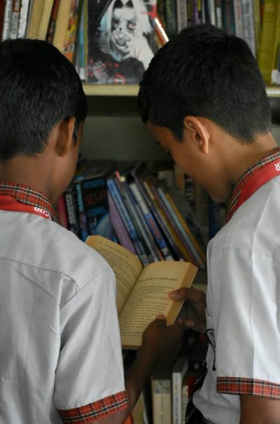 Educarians searching for a good read in the Library
